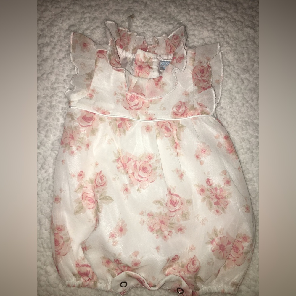 Pink flower covered button onesie
